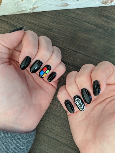 Microsoft nails with MS logo and clippy painted on