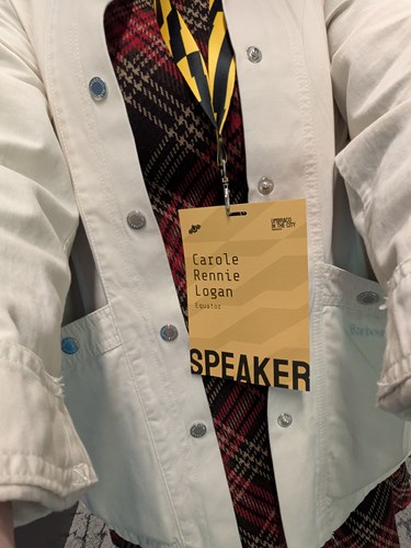 Umbraco in the City Speakers lanyard with a tartan dress